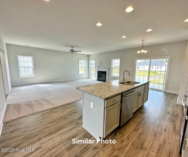 1822 Olde Towne Pointe Blvd, Jacksonville, NC 28546 - kitchen featuring a sink, stainless steel dishwasher, baseboards, healthy amount of natural light, and a textured ceiling