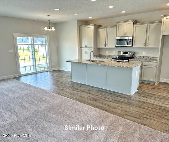 1822 Olde Towne Pointe Blvd, Jacksonville, NC 28546 - kitchen with stainless steel appliances, a sink, baseboards, recessed lighting, and a chandelier