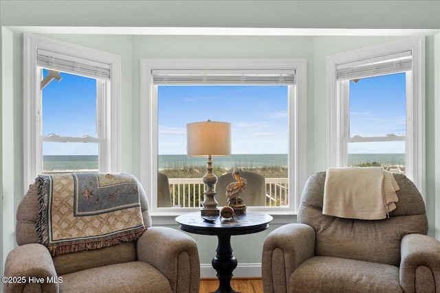 1033 Ocean Blvd W, Holden Beach, NC 28462 - sitting room with wood finished floors and healthy amount of natural light