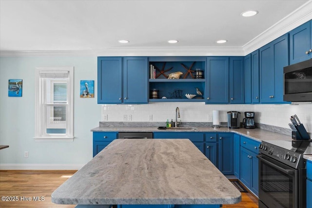 1033 Ocean Blvd W, Holden Beach, NC 28462 - kitchen with appliances with stainless steel finishes, a center island, decorative backsplash, light stone countertops, and blue cabinetry