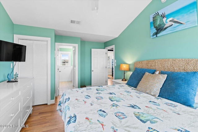 1033 Ocean Blvd W, Holden Beach, NC 28462 - bedroom with a closet and light wood-style flooring