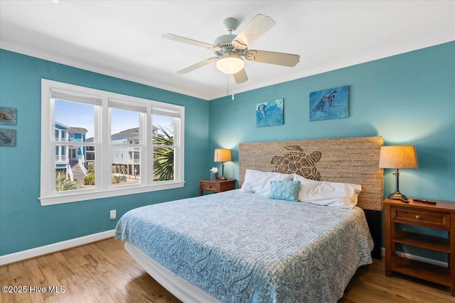 1033 Ocean Blvd W, Holden Beach, NC 28462 - bedroom with wood finished floors, ornamental molding, and a ceiling fan