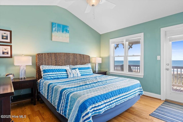 1033 Ocean Blvd W, Holden Beach, NC 28462 - bedroom featuring wood finished floors, vaulted ceiling, a ceiling fan, and access to outside
