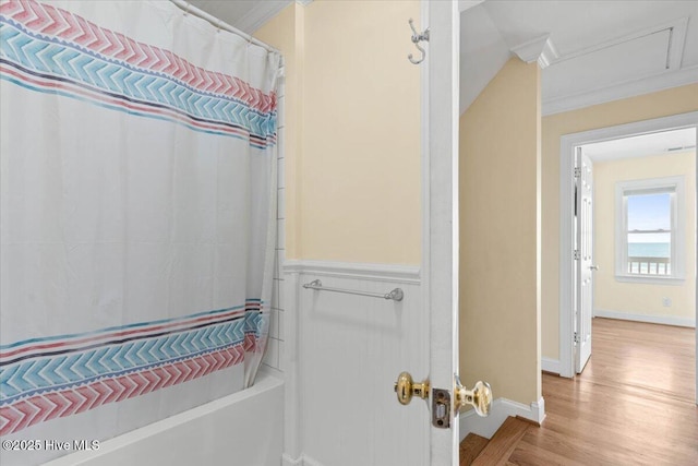1033 Ocean Blvd W, Holden Beach, NC 28462 - full bath with wood finished floors, crown molding, and shower / bath combination with curtain