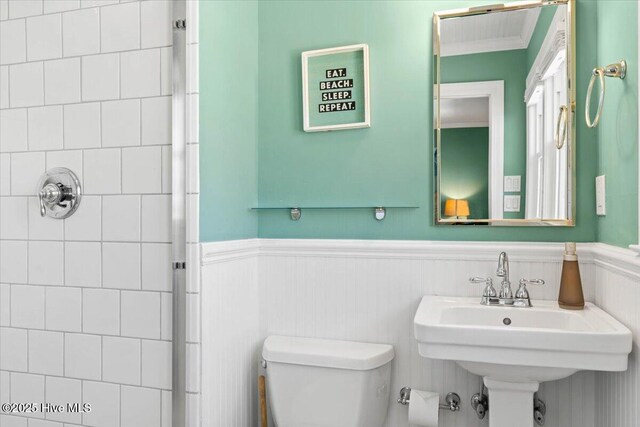 1033 Ocean Blvd W, Holden Beach, NC 28462 - full bath featuring a shower stall and a wainscoted wall