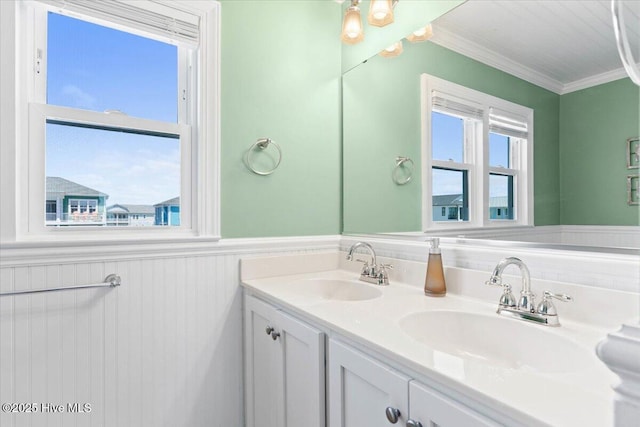 1033 Ocean Blvd W, Holden Beach, NC 28462 - bathroom featuring a wainscoted wall, double vanity, and ornamental molding
