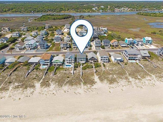 1033 Ocean Blvd W, Holden Beach, NC 28462 - aerial view of residential area with a large body of water