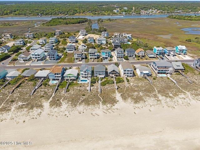 1033 Ocean Blvd W, Holden Beach, NC 28462 - aerial perspective of suburban area featuring a large body of water