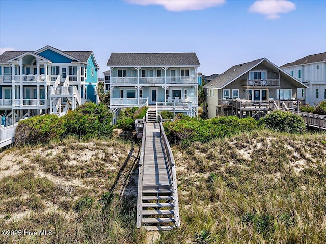 1033 Ocean Blvd W, Holden Beach, NC 28462 - rear view of property with a balcony