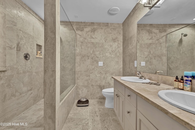 208 Bloomington Ln, Wilmington, NC 28411 - bathroom featuring a walk in shower, double vanity, toilet, and tile walls