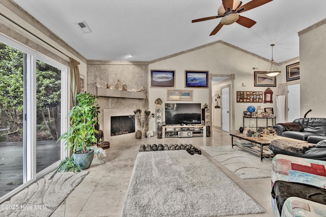 208 Bloomington Ln, Wilmington, NC 28411 - living room featuring a ceiling fan, vaulted ceiling, and a fireplace