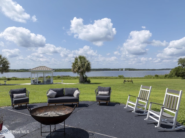 4 Hunter Heath Dr, North Topsail Beach, NC 28460 - view of patio / terrace with a gazebo, a water view, and a fire pit