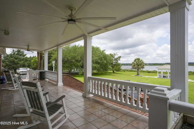 4 Hunter Heath Dr, North Topsail Beach, NC 28460 - porch with a ceiling fan, a water view, a yard, and a gazebo