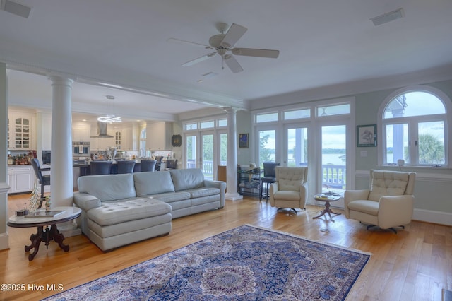 4 Hunter Heath Dr, North Topsail Beach, NC 28460 - living room with ornate columns, wood-type flooring, ornamental molding, and a ceiling fan
