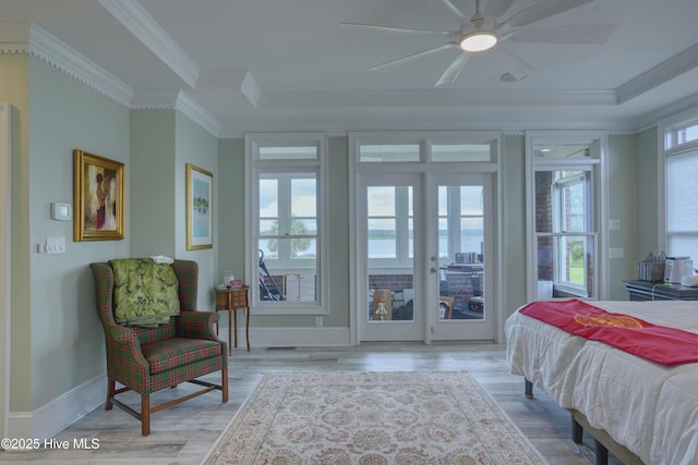 4 Hunter Heath Dr, North Topsail Beach, NC 28460 - bedroom with access to exterior, ornamental molding, wood finished floors, a tray ceiling, and ceiling fan