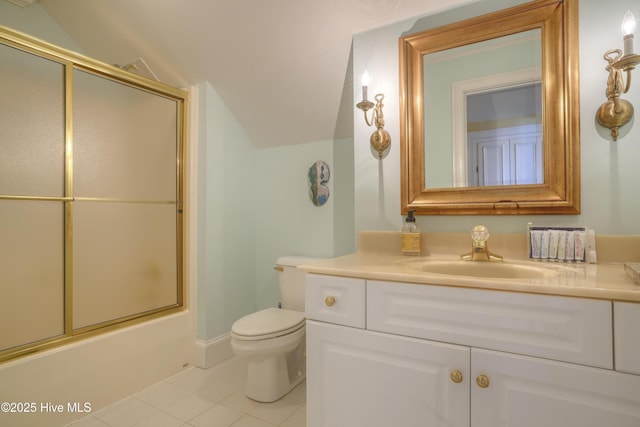 4 Hunter Heath Dr, North Topsail Beach, NC 28460 - bathroom with vanity, tile patterned floors, vaulted ceiling, and enclosed tub / shower combo