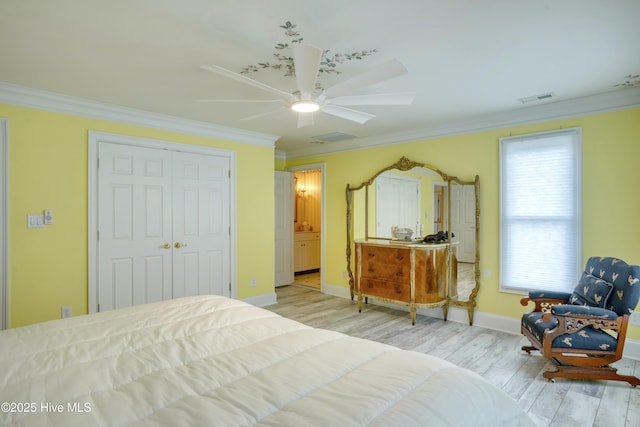 4 Hunter Heath Dr, North Topsail Beach, NC 28460 - bedroom with crown molding, wood finished floors, a closet, and ceiling fan