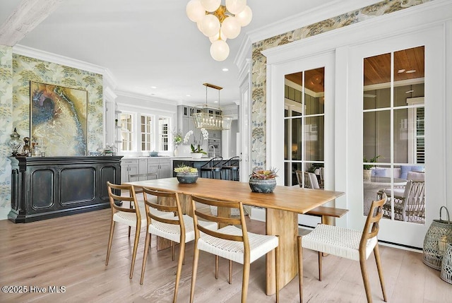 1830 Senova Trce, Wilmington, NC 28405 - dining space with a chandelier, light wood-style floors, ornamental molding, and recessed lighting