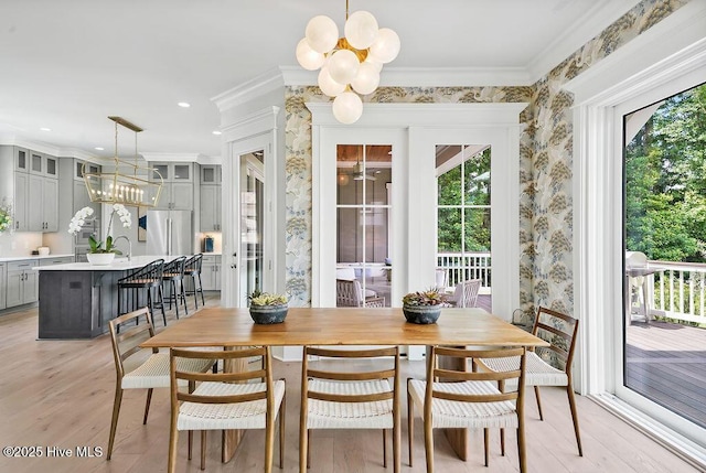 1830 Senova Trce, Wilmington, NC 28405 - dining space featuring a chandelier, ornamental molding, and light wood-style floors