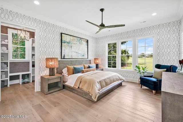 1830 Senova Trce, Wilmington, NC 28405 - bedroom featuring wallpapered walls, ornamental molding, light wood-style floors, a chandelier, and recessed lighting