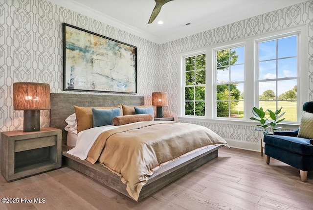 1830 Senova Trce, Wilmington, NC 28405 - bedroom featuring wallpapered walls, ornamental molding, and wood-type flooring