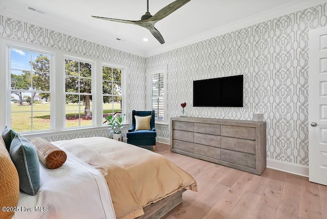 1830 Senova Trce, Wilmington, NC 28405 - bedroom with wallpapered walls, crown molding, wood finished floors, and a ceiling fan
