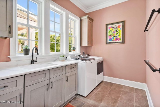 1830 Senova Trce, Wilmington, NC 28405 - washroom featuring cabinet space, independent washer and dryer, plenty of natural light, ornamental molding, and light tile patterned floors