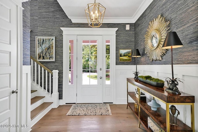 1830 Senova Trce, Wilmington, NC 28405 - foyer entrance featuring stairway, a chandelier, ornamental molding, and wood finished floors