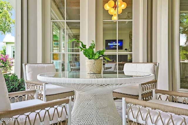 1830 Senova Trce, Wilmington, NC 28405 - sunroom featuring a chandelier and plenty of natural light