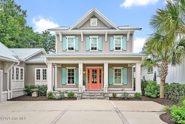 1830 Senova Trce, Wilmington, NC 28405 - view of front facade featuring a porch, board and batten siding, and a metal roof