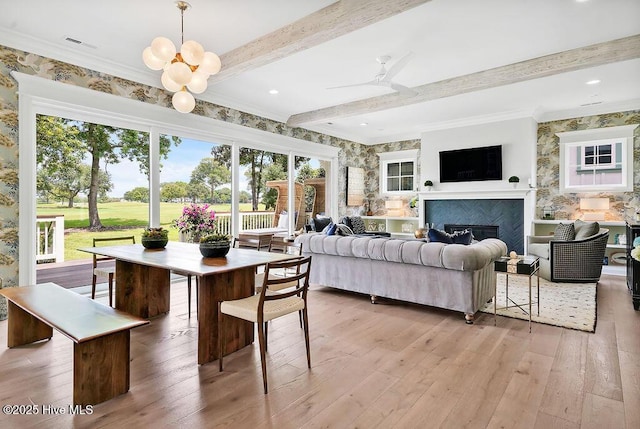 1830 Senova Trce, Wilmington, NC 28405 - living room with light wood-style flooring, beamed ceiling, a glass covered fireplace, ceiling fan, and crown molding