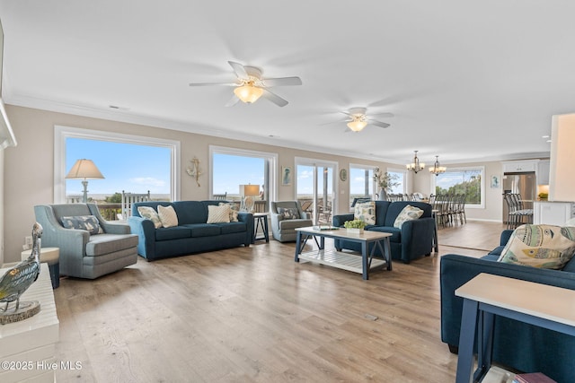 1239 Ocean Blvd W, Holden Beach, NC 28462 - living area featuring ceiling fan, ornamental molding, light wood-style flooring, and a chandelier
