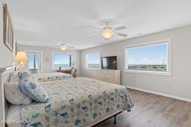 1239 Ocean Blvd W, Holden Beach, NC 28462 - bedroom featuring wood finished floors and ceiling fan