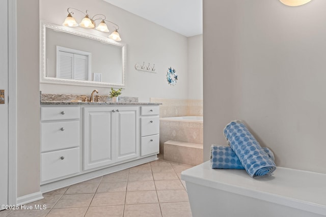 1239 Ocean Blvd W, Holden Beach, NC 28462 - bathroom featuring vanity, a garden tub, and tile patterned flooring