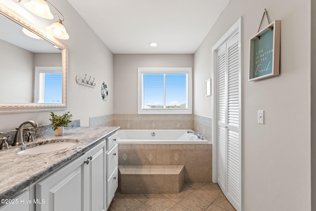 1239 Ocean Blvd W, Holden Beach, NC 28462 - bathroom featuring a closet, vanity, plenty of natural light, tile patterned flooring, and recessed lighting