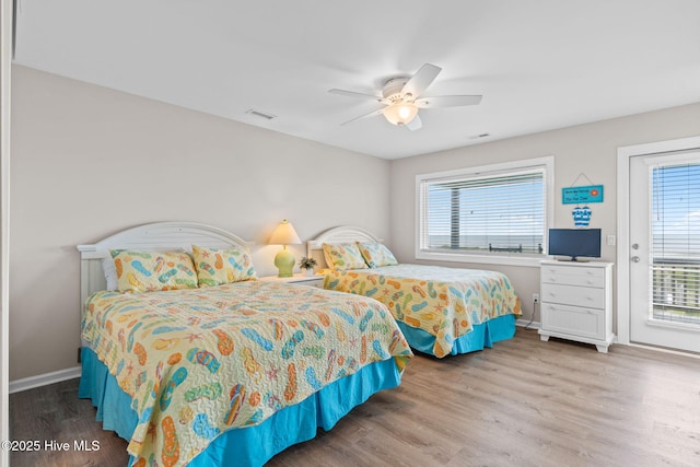 1239 Ocean Blvd W, Holden Beach, NC 28462 - bedroom with wood finished floors, access to exterior, and a ceiling fan