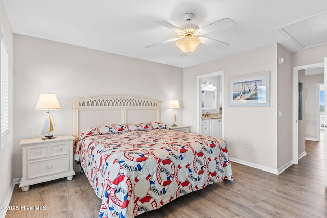 1239 Ocean Blvd W, Holden Beach, NC 28462 - bedroom featuring attic access, light wood-style floors, ensuite bath, and a ceiling fan