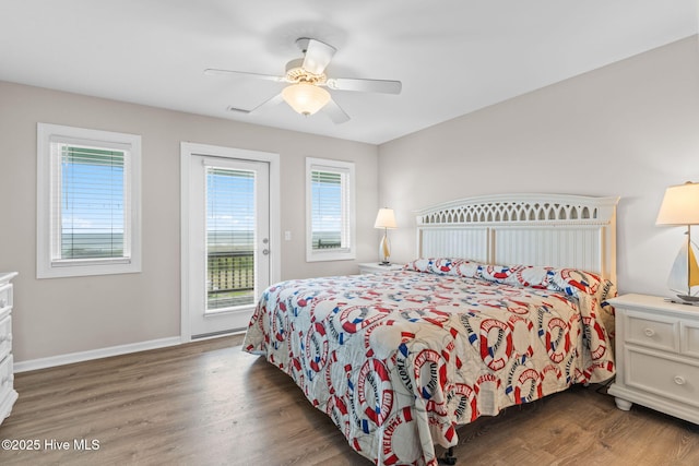 1239 Ocean Blvd W, Holden Beach, NC 28462 - bedroom with access to exterior, wood finished floors, and ceiling fan