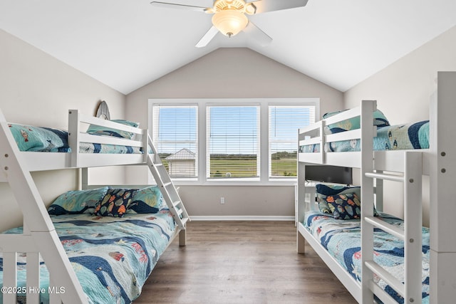 1239 Ocean Blvd W, Holden Beach, NC 28462 - bedroom with wood finished floors, vaulted ceiling, and a ceiling fan