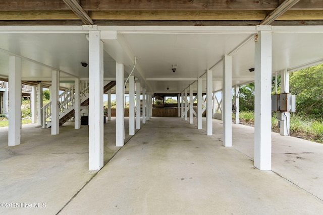 1239 Ocean Blvd W, Holden Beach, NC 28462 - view of patio featuring stairs and a carport
