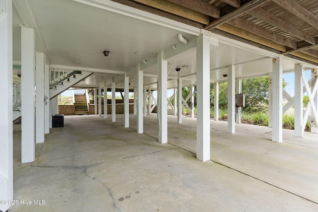 1239 Ocean Blvd W, Holden Beach, NC 28462 - view of patio with stairway and a carport