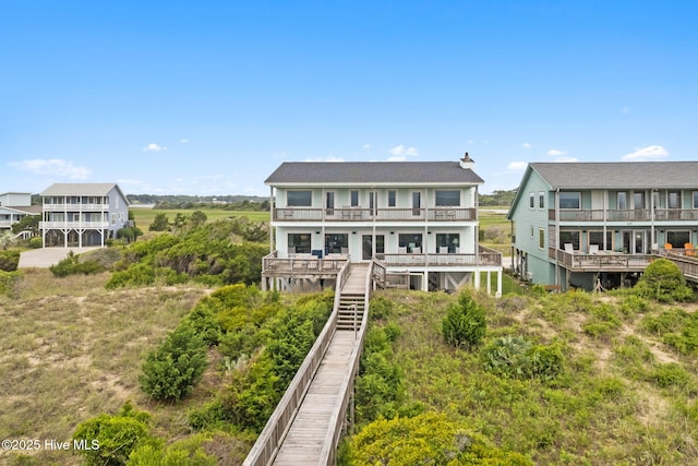 1239 Ocean Blvd W, Holden Beach, NC 28462 - back of house with a balcony