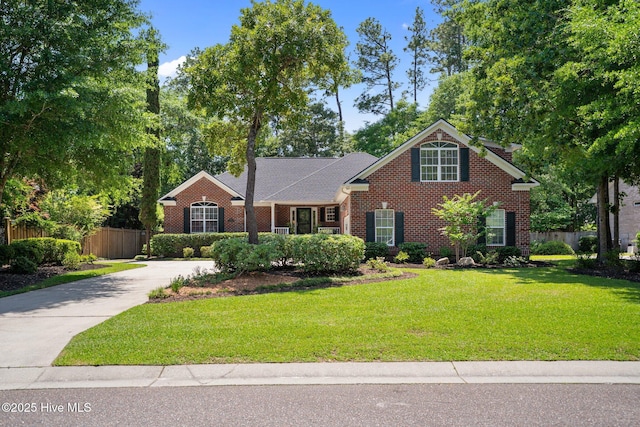 5752 Gardenia Ln, Wilmington, NC 28409 - view of front of house with brick siding and concrete driveway