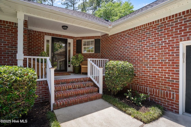 5752 Gardenia Ln, Wilmington, NC 28409 - entrance to property featuring a porch and brick siding