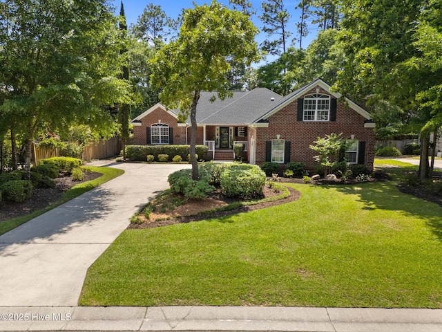 5752 Gardenia Ln, Wilmington, NC 28409 - traditional-style home with brick siding and driveway
