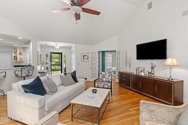 5752 Gardenia Ln, Wilmington, NC 28409 - living room with light wood-type flooring, a ceiling fan, and high vaulted ceiling