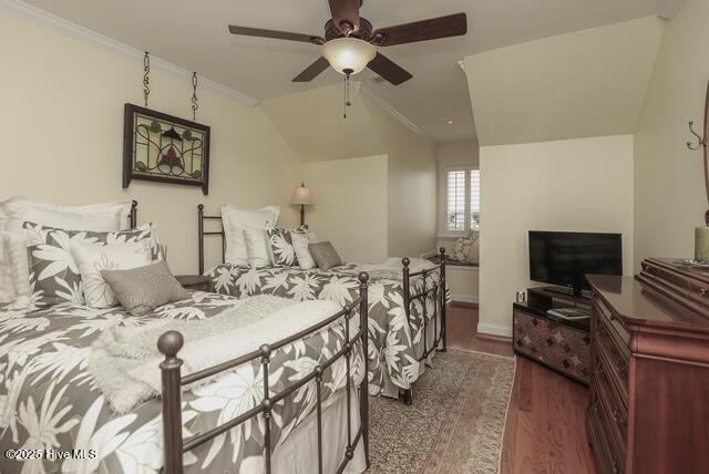 1 Burton Pl, Jacksonville, NC 28540 - bedroom featuring wood finished floors, ornamental molding, a ceiling fan, and vaulted ceiling
