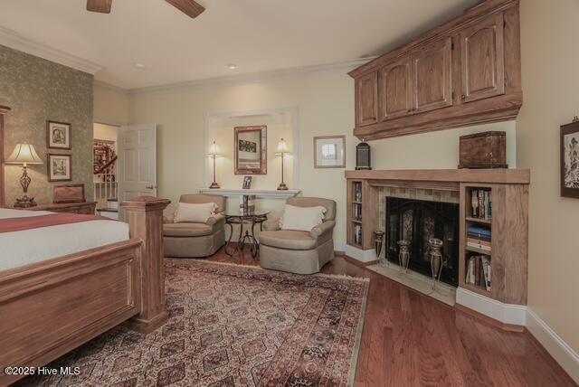 1 Burton Pl, Jacksonville, NC 28540 - bedroom with wood finished floors, a large fireplace, and ornamental molding
