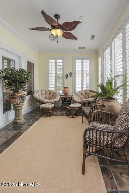 1 Burton Pl, Jacksonville, NC 28540 - living area featuring ornamental molding, ceiling fan, and stone tile floors