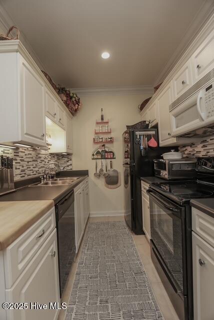 1 Burton Pl, Jacksonville, NC 28540 - kitchen featuring black electric range oven, white microwave, dishwashing machine, white cabinetry, and tasteful backsplash